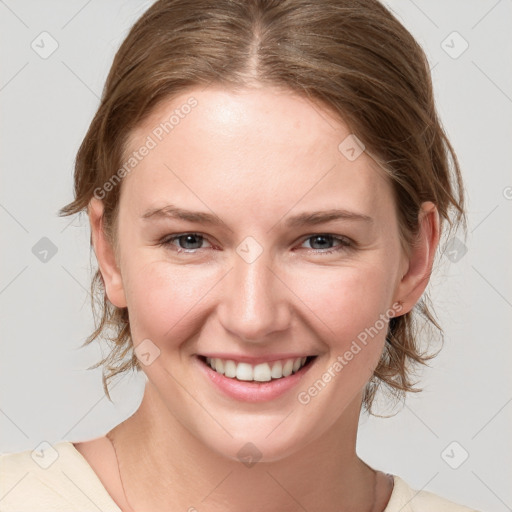 Joyful white young-adult female with medium  brown hair and blue eyes