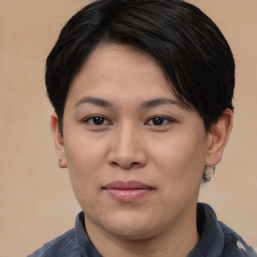 Joyful asian young-adult female with short  brown hair and brown eyes