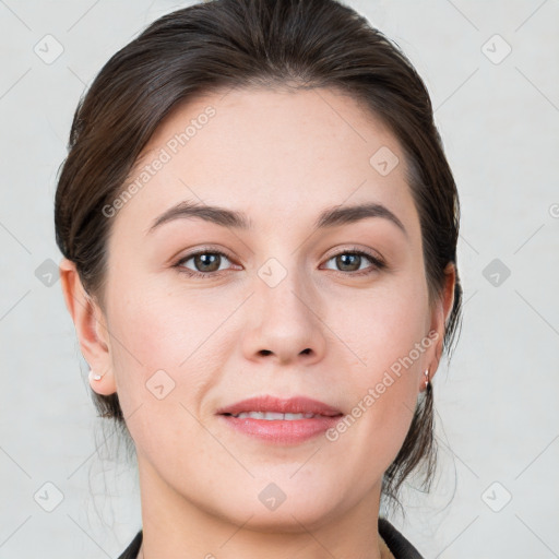 Joyful white young-adult female with medium  brown hair and grey eyes