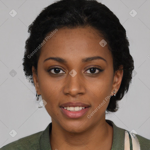 Joyful black young-adult female with short  black hair and brown eyes