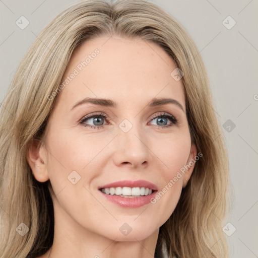 Joyful white young-adult female with long  brown hair and green eyes