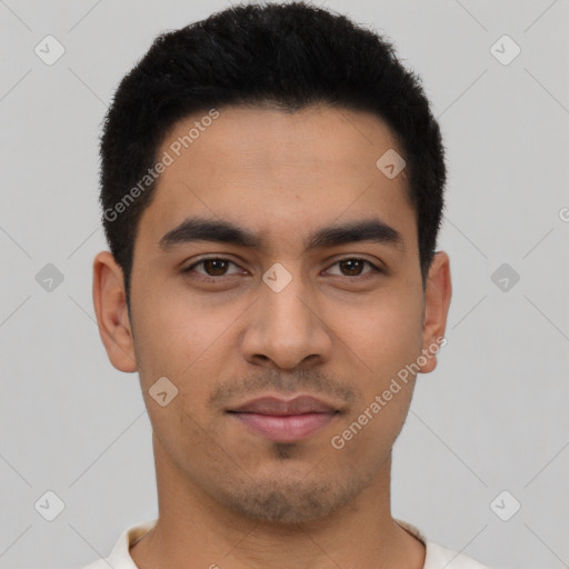 Joyful latino young-adult male with short  brown hair and brown eyes