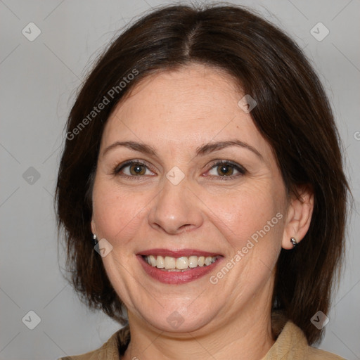 Joyful white adult female with medium  brown hair and brown eyes