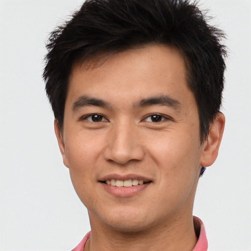 Joyful asian young-adult male with short  brown hair and brown eyes