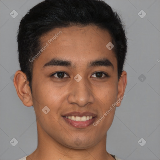 Joyful latino young-adult male with short  black hair and brown eyes