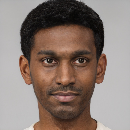 Neutral black young-adult male with short  black hair and brown eyes