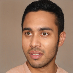 Joyful latino young-adult male with short  black hair and brown eyes