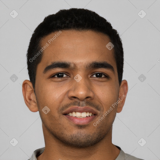 Joyful latino young-adult male with short  black hair and brown eyes