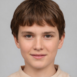 Joyful white child male with short  brown hair and brown eyes