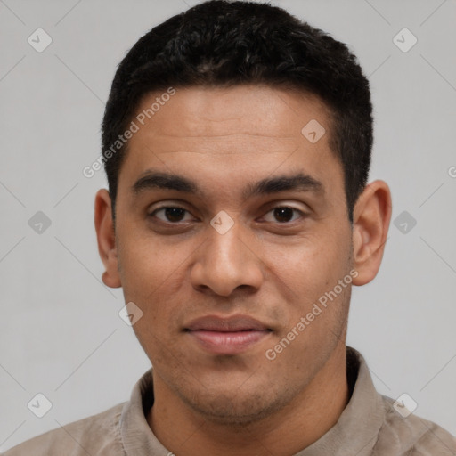 Joyful latino young-adult male with short  black hair and brown eyes