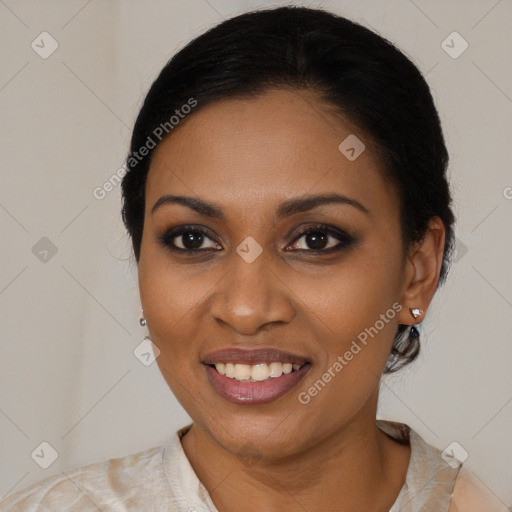 Joyful black young-adult female with medium  brown hair and brown eyes