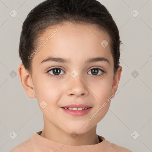 Joyful white child female with short  brown hair and brown eyes