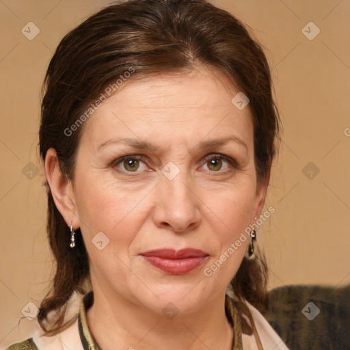 Joyful white adult female with medium  brown hair and brown eyes