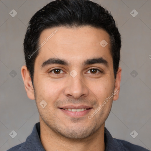 Joyful white young-adult male with short  black hair and brown eyes