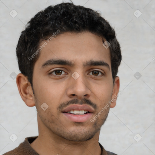 Joyful latino young-adult male with short  brown hair and brown eyes