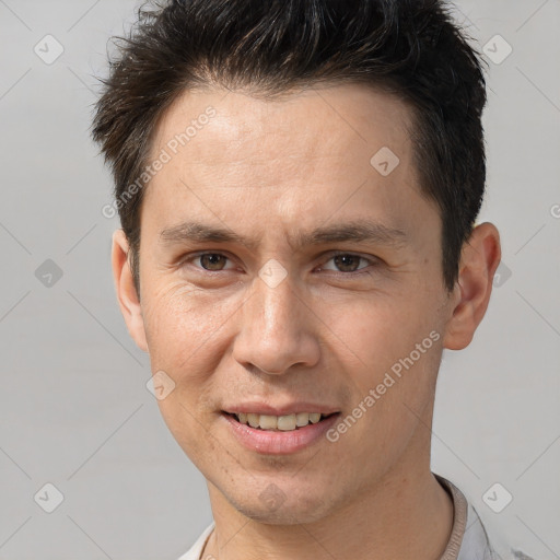 Joyful white adult male with short  brown hair and brown eyes