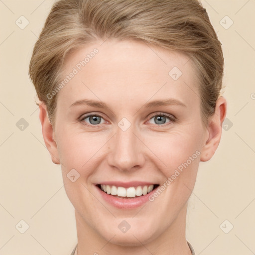 Joyful white young-adult female with short  brown hair and grey eyes