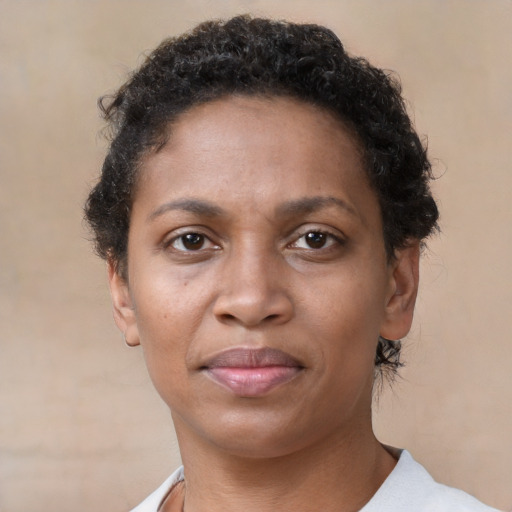 Neutral black adult female with short  brown hair and brown eyes