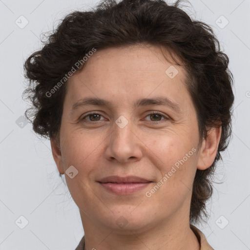 Joyful white adult female with short  brown hair and brown eyes