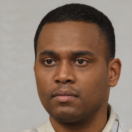 Neutral black young-adult male with short  black hair and brown eyes