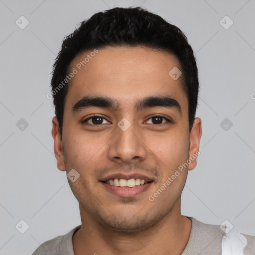 Joyful latino young-adult male with short  black hair and brown eyes