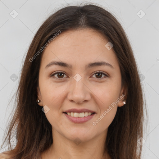 Joyful white young-adult female with long  brown hair and brown eyes