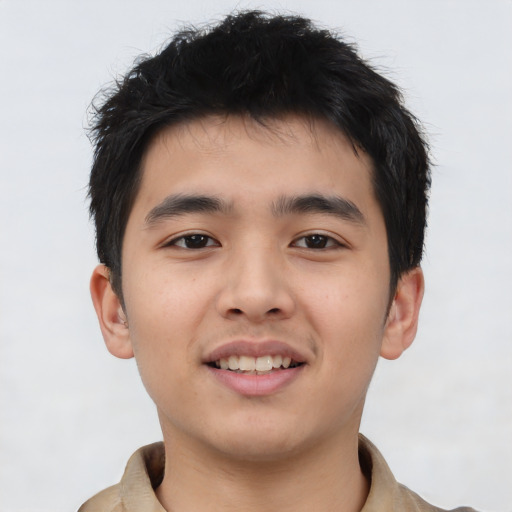 Joyful asian young-adult male with short  brown hair and brown eyes