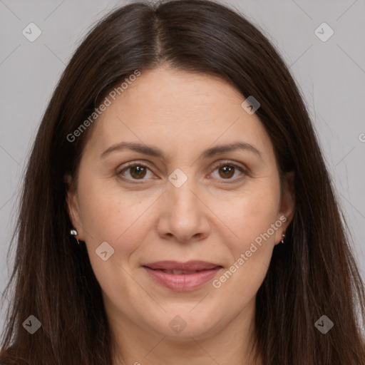 Joyful white adult female with long  brown hair and brown eyes