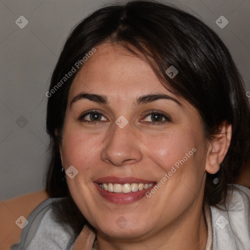 Joyful white adult female with medium  brown hair and brown eyes