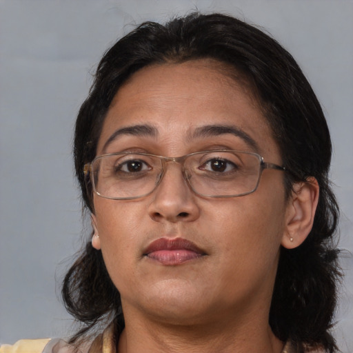 Neutral asian adult female with medium  brown hair and brown eyes