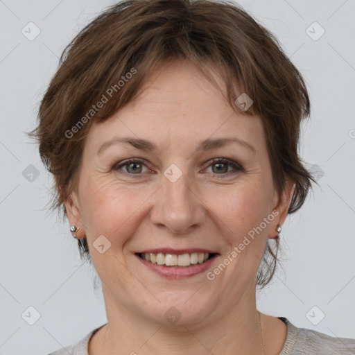 Joyful white adult female with short  brown hair and brown eyes