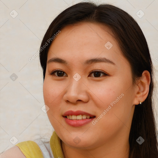 Joyful asian young-adult female with long  brown hair and brown eyes