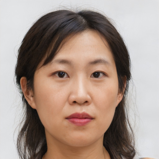 Neutral asian young-adult female with medium  brown hair and brown eyes