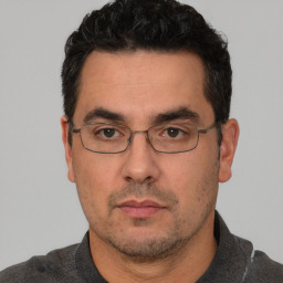 Neutral white adult male with short  black hair and brown eyes