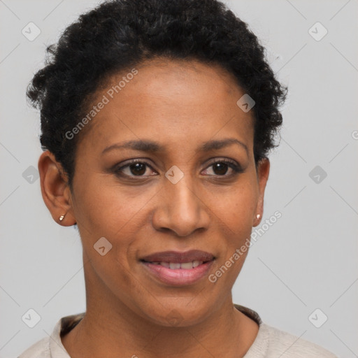 Joyful black adult female with short  brown hair and brown eyes