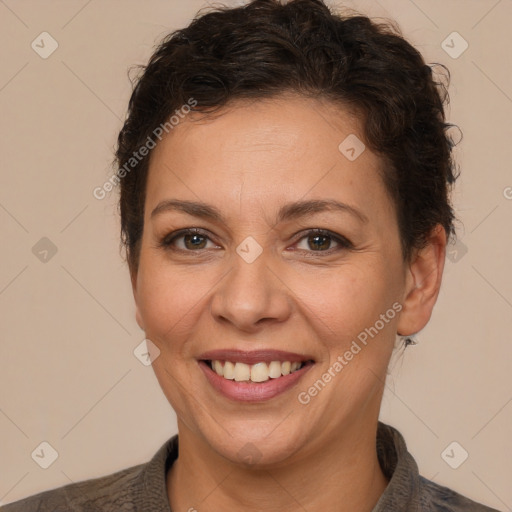 Joyful white adult female with short  brown hair and brown eyes