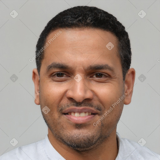 Joyful latino adult male with short  black hair and brown eyes