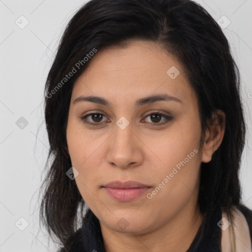 Joyful latino young-adult female with long  brown hair and brown eyes