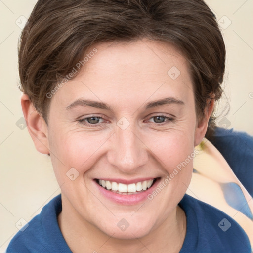 Joyful white young-adult female with short  brown hair and grey eyes