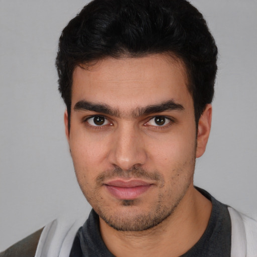 Neutral white young-adult male with short  black hair and brown eyes