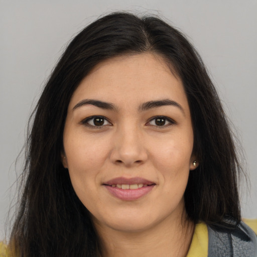 Joyful asian young-adult female with long  brown hair and brown eyes