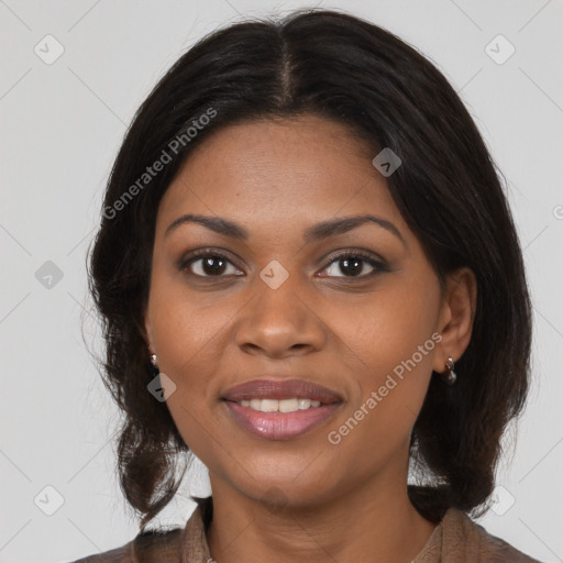 Joyful black young-adult female with medium  brown hair and brown eyes