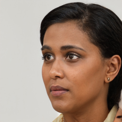 Neutral black young-adult female with short  black hair and brown eyes