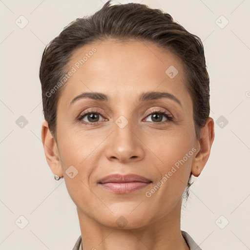 Joyful white adult female with short  brown hair and brown eyes