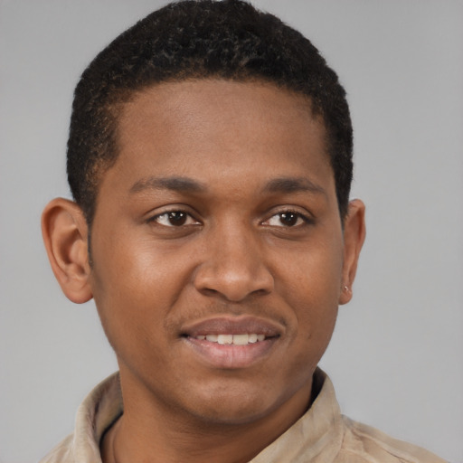 Joyful black young-adult male with short  brown hair and brown eyes