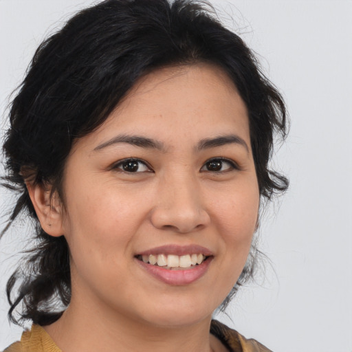 Joyful asian young-adult female with medium  brown hair and brown eyes