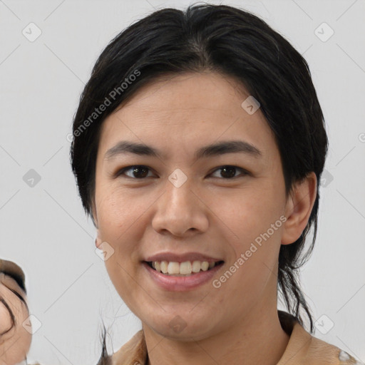 Joyful asian young-adult female with medium  black hair and brown eyes