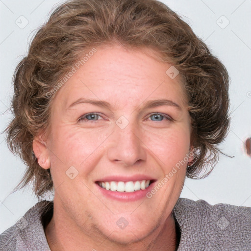 Joyful white adult female with medium  brown hair and blue eyes