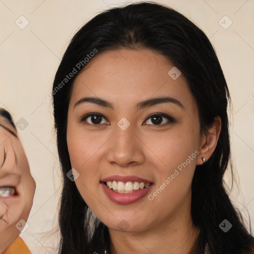 Joyful latino young-adult female with long  black hair and brown eyes