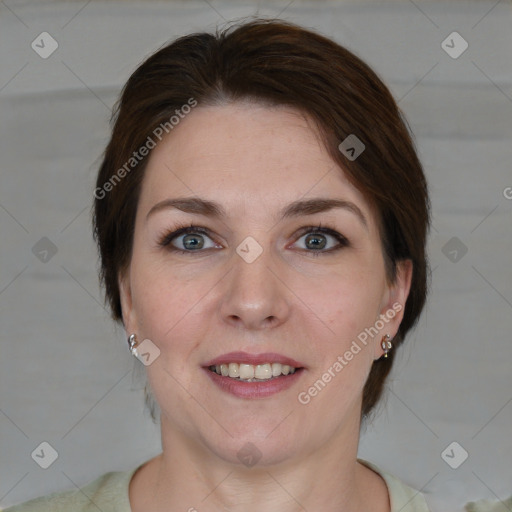 Joyful white young-adult female with medium  brown hair and green eyes